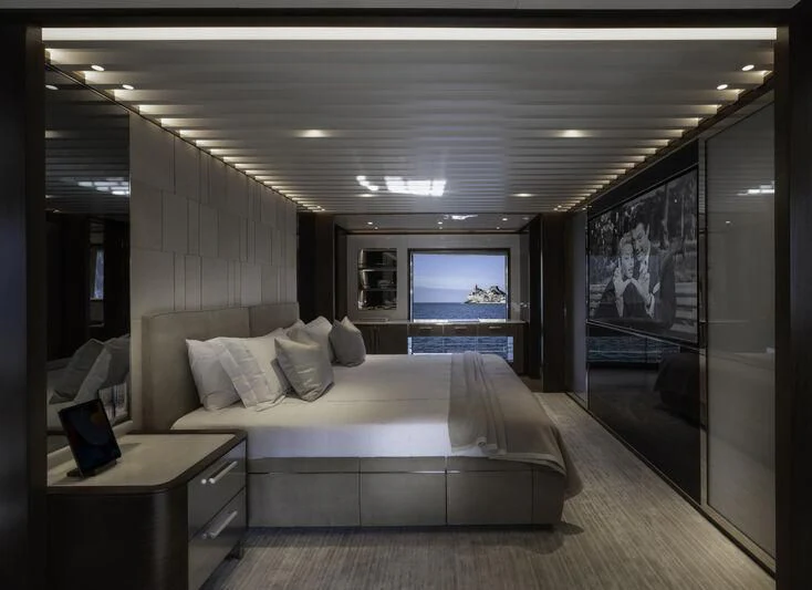 a bedroom with a large bed aboard ENTERPRISE Yacht for Charter