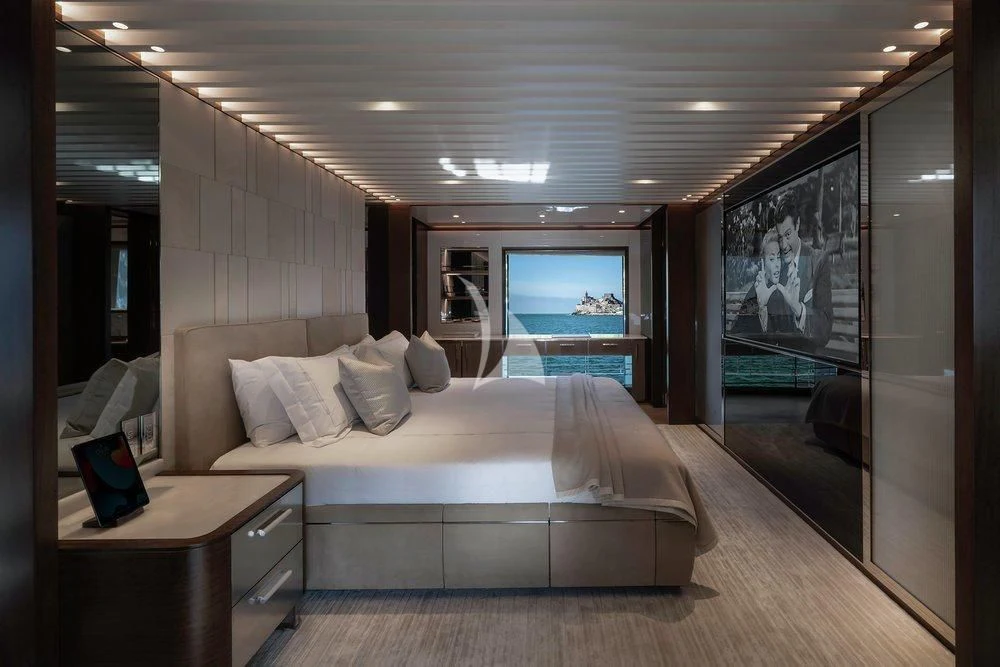 a hotel room with a large bed aboard ENTERPRISE Yacht for Charter