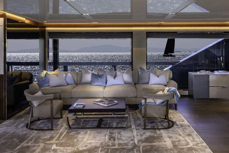 a living room with a large window aboard ENTERPRISE Yacht for Charter