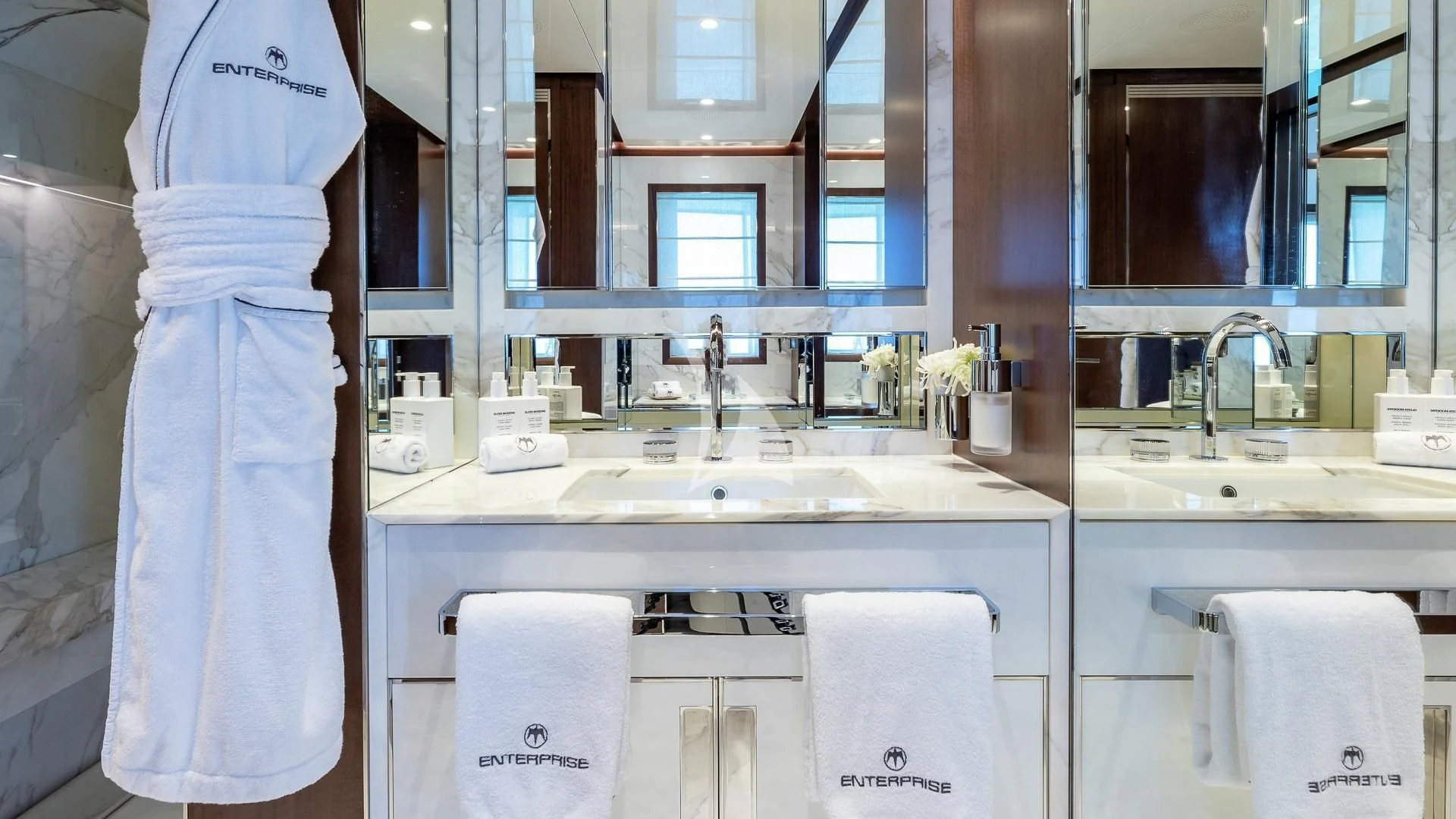 a bathroom with a sink and a mirror aboard ENTERPRISE Yacht for Charter