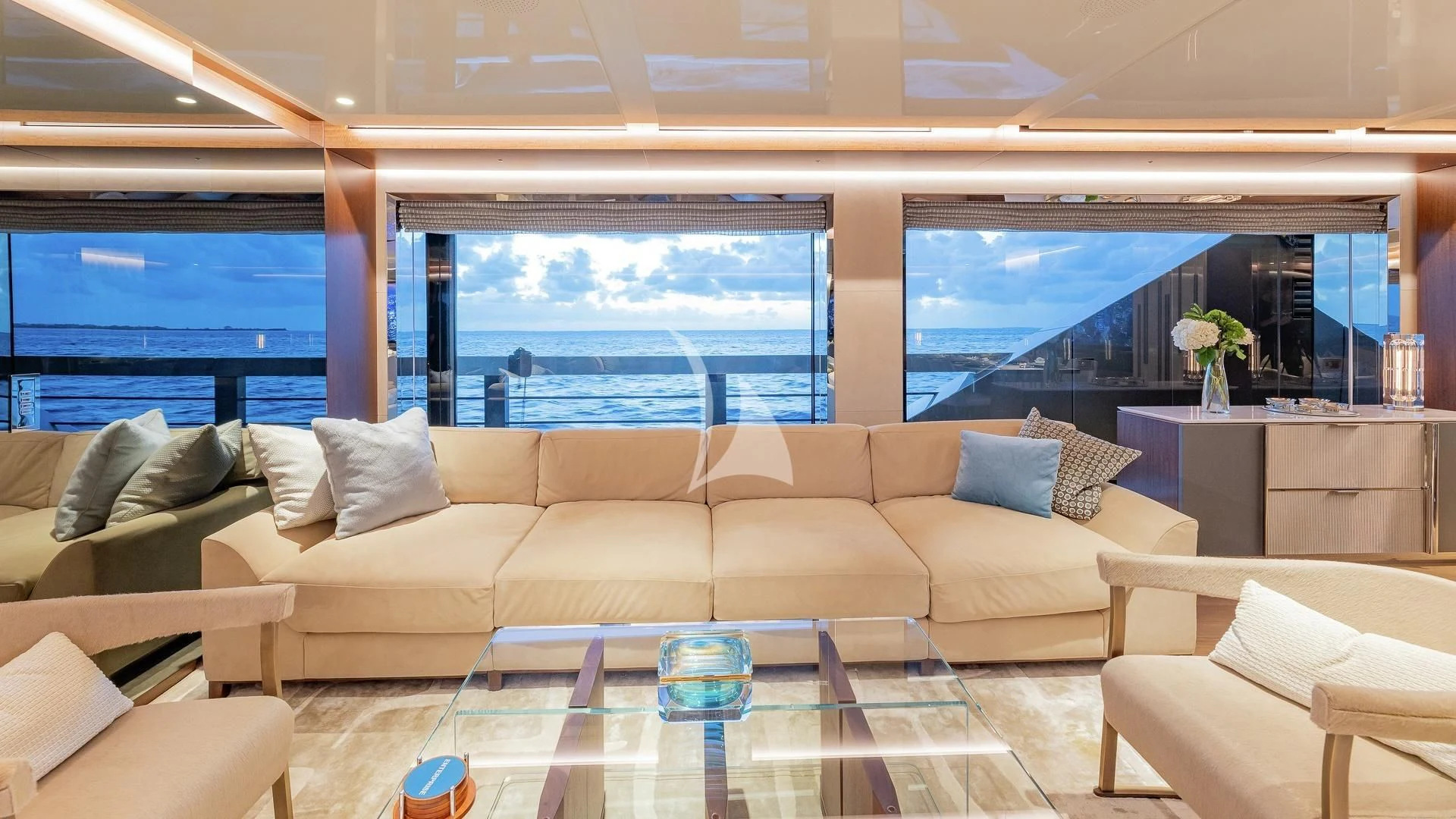 a living room with a large window aboard ENTERPRISE Yacht for Charter
