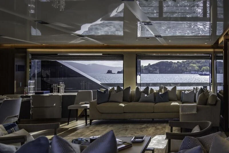 a living room with a large window aboard ENTERPRISE Yacht for Charter