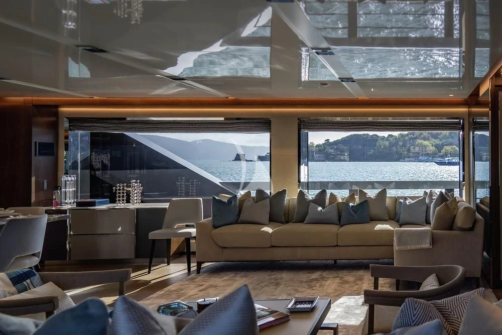 a living room with a large window aboard ENTERPRISE Yacht for Charter