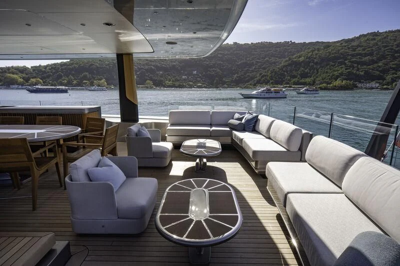 a patio with a table and chairs aboard ENTERPRISE Yacht for Charter