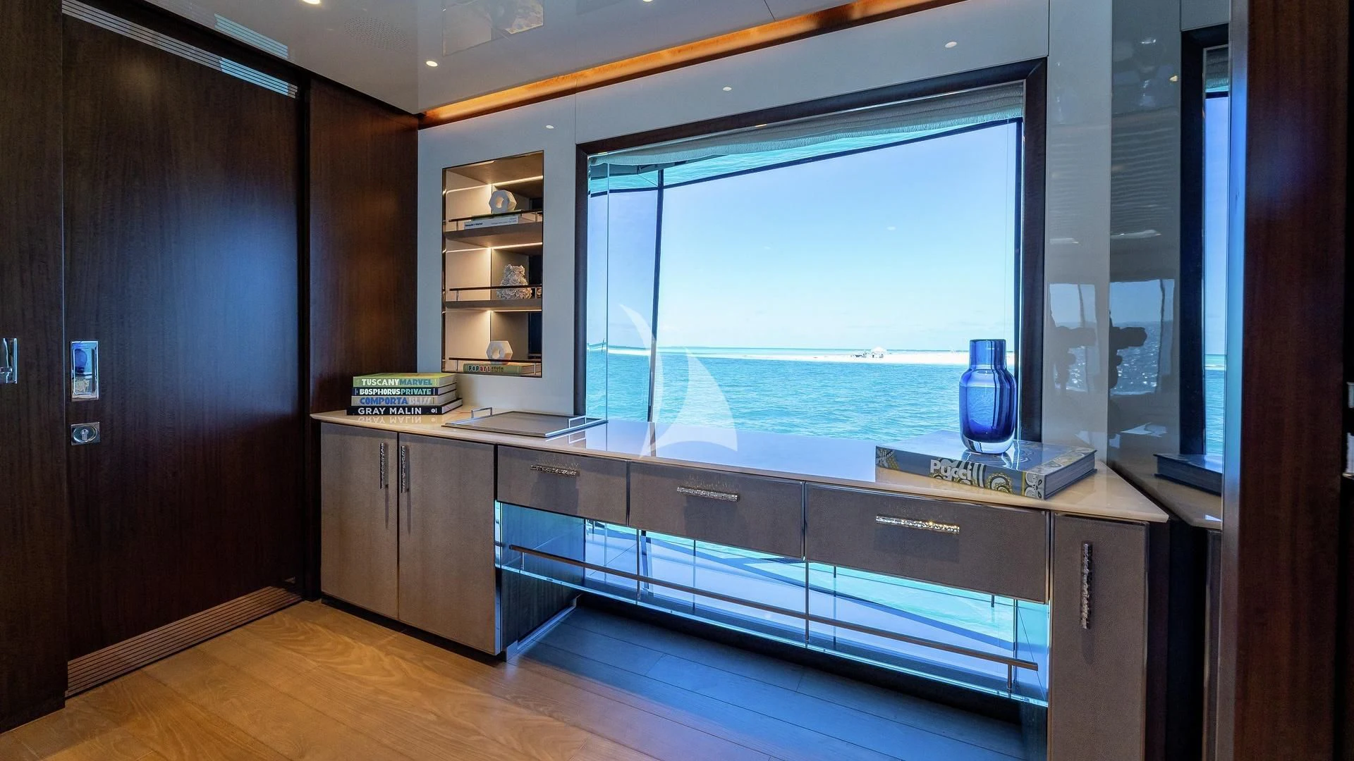 a room with a large window and a view of the ocean aboard ENTERPRISE Yacht for Charter