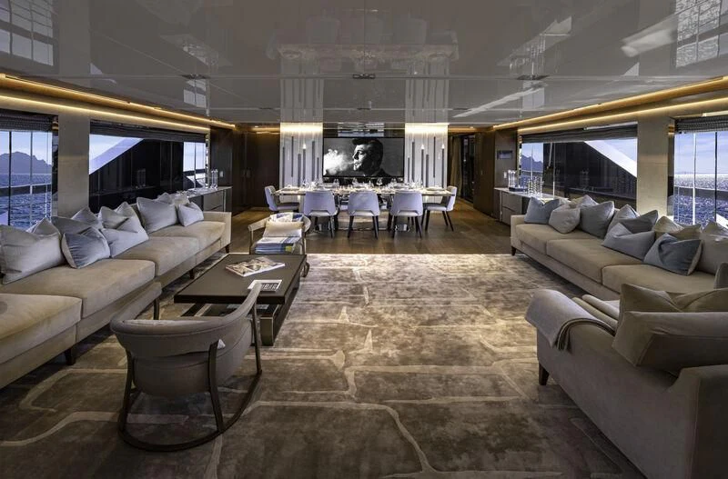 a large living room with a large window aboard ENTERPRISE Yacht for Charter