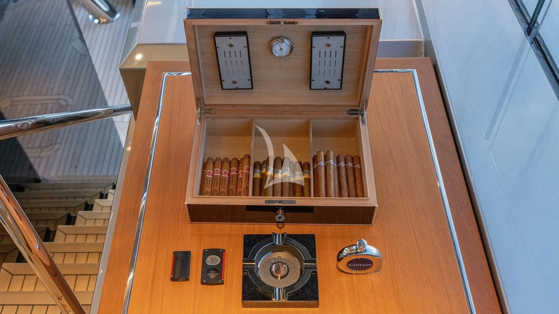 a wooden cabinet with a clock aboard ENTERPRISE Yacht for Charter