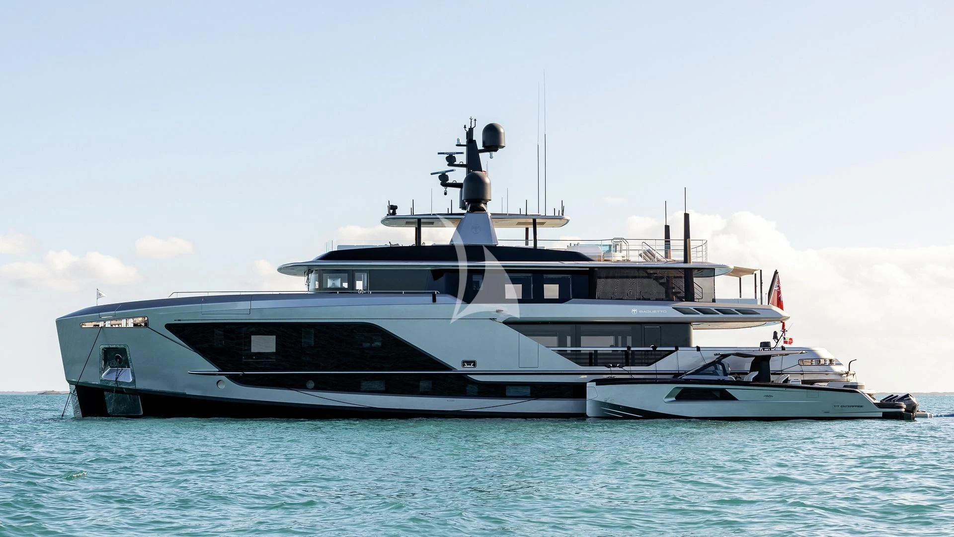 a large boat in the water aboard ENTERPRISE Yacht for Charter