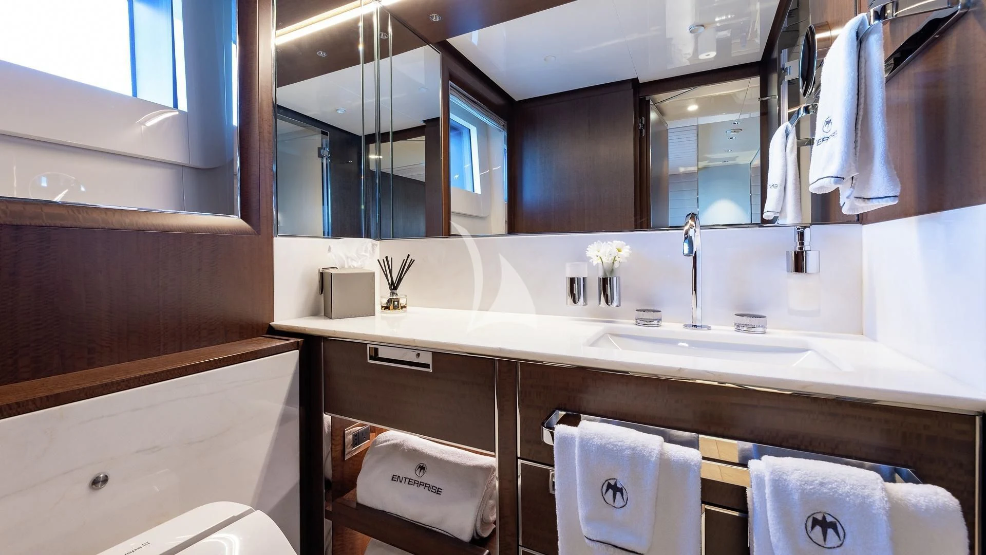 a bathroom with a large mirror aboard ENTERPRISE Yacht for Charter