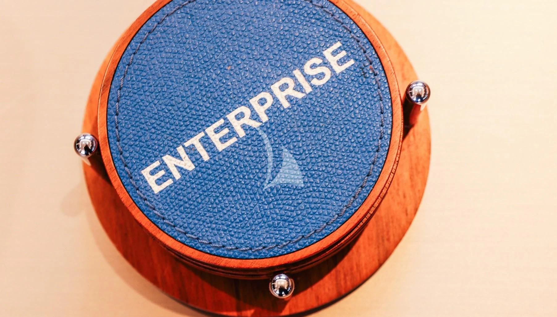 a wooden box with a picture of a person on it aboard ENTERPRISE Yacht for Charter
