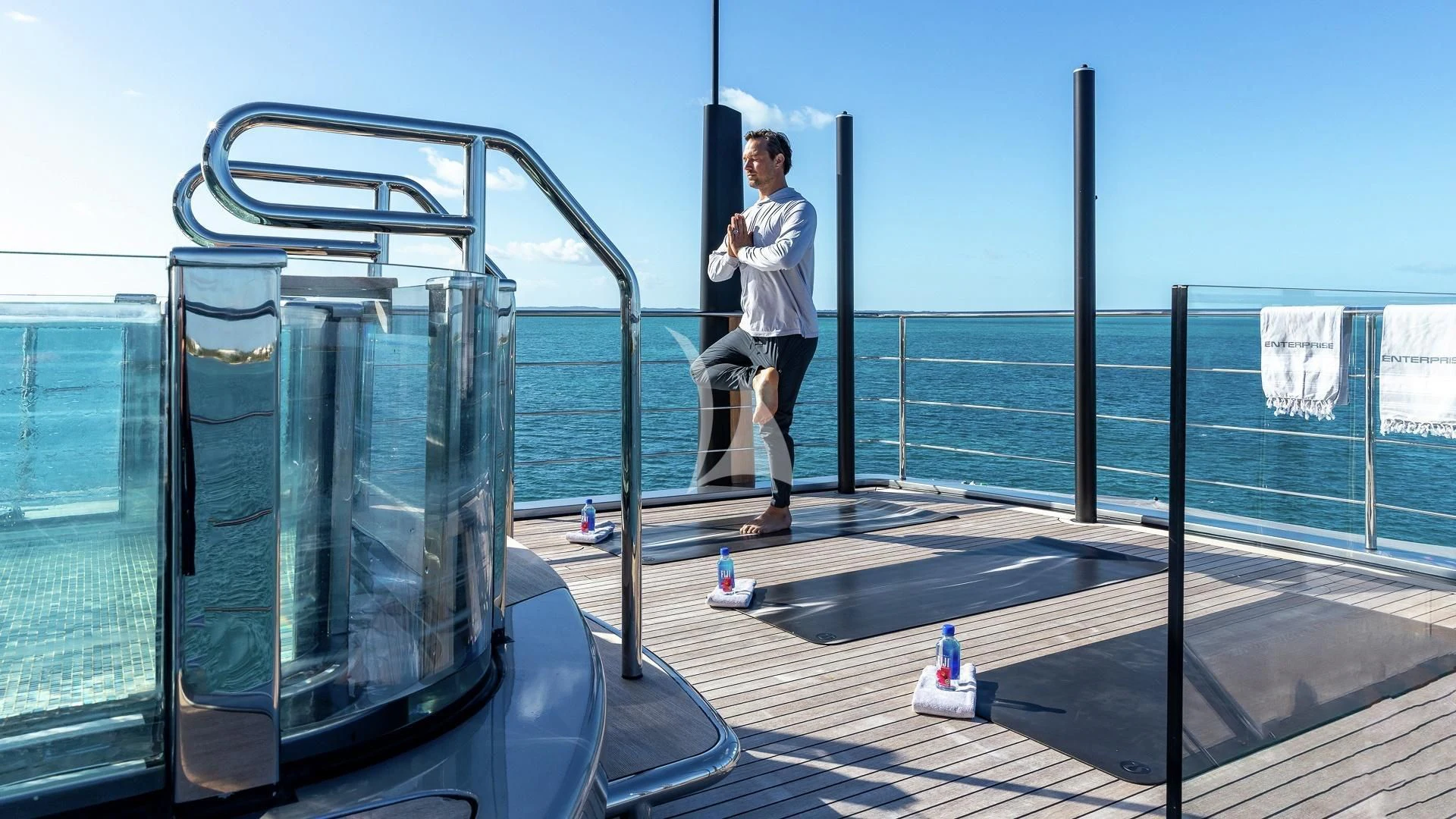 a person standing on a deck aboard ENTERPRISE Yacht for Charter