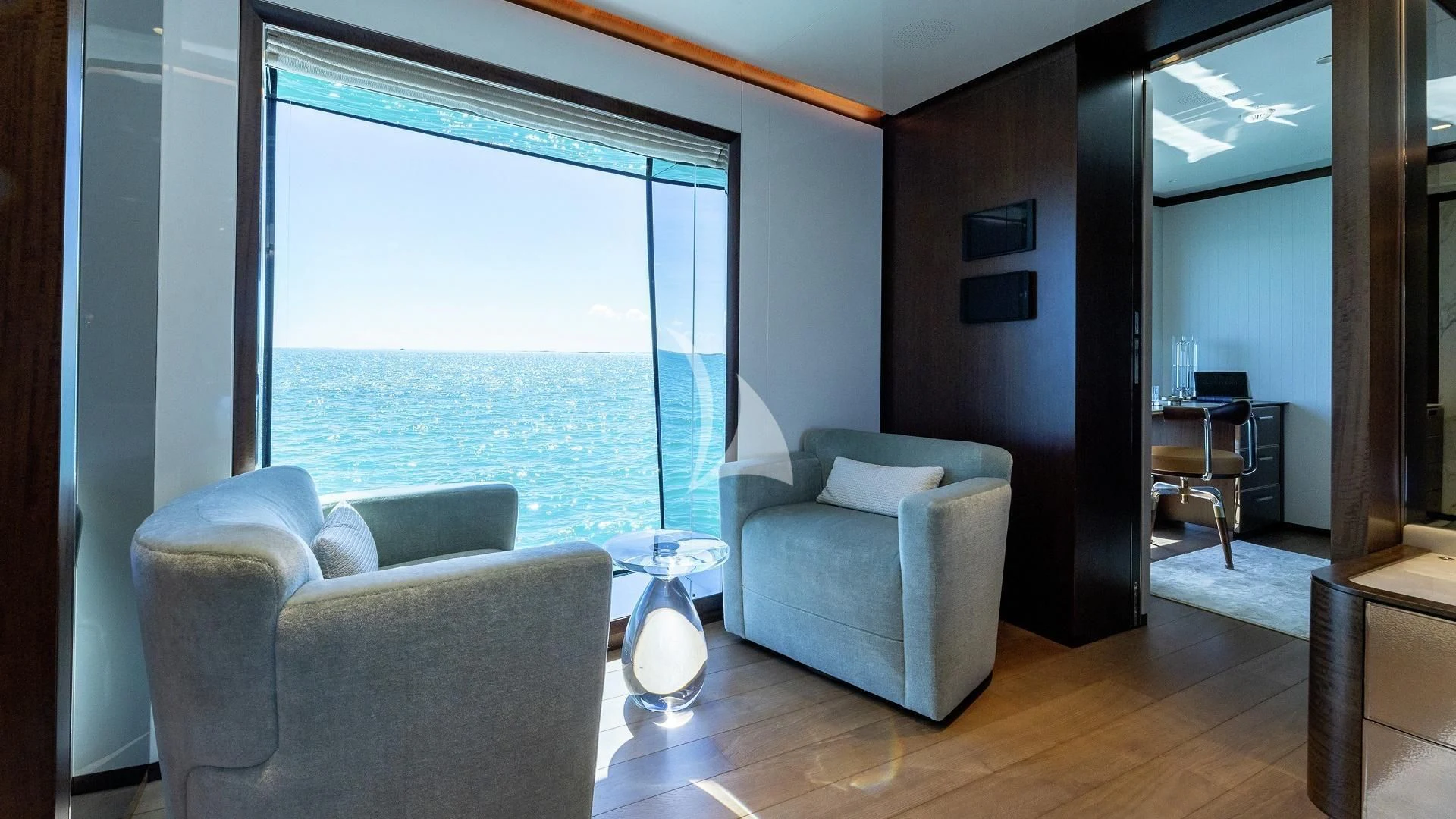 a living room with a large window aboard ENTERPRISE Yacht for Charter