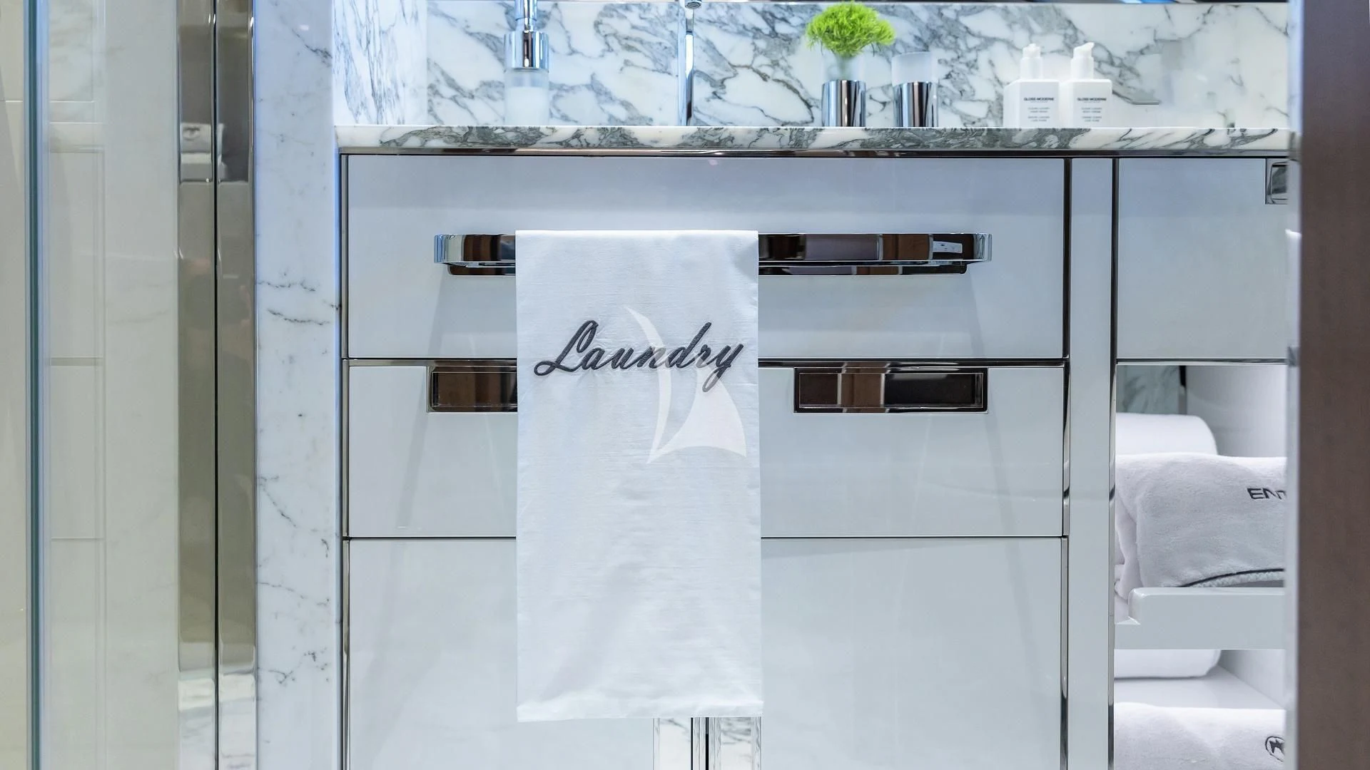 a white refrigerator with a note on it aboard ENTERPRISE Yacht for Charter