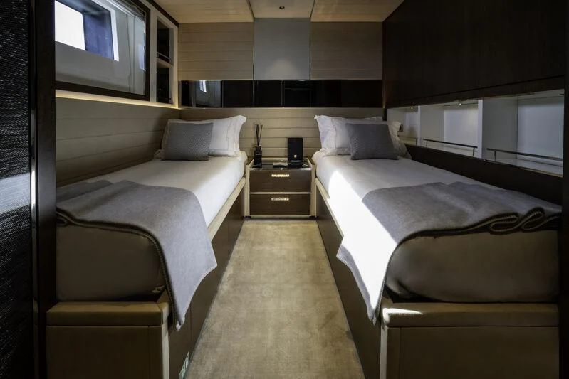 a room with two beds aboard ENTERPRISE Yacht for Charter