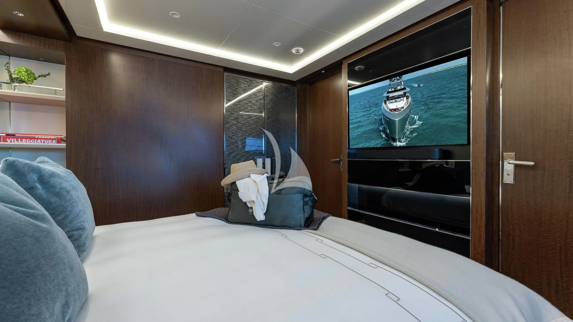 a person lying on a bed aboard ENTERPRISE Yacht for Charter