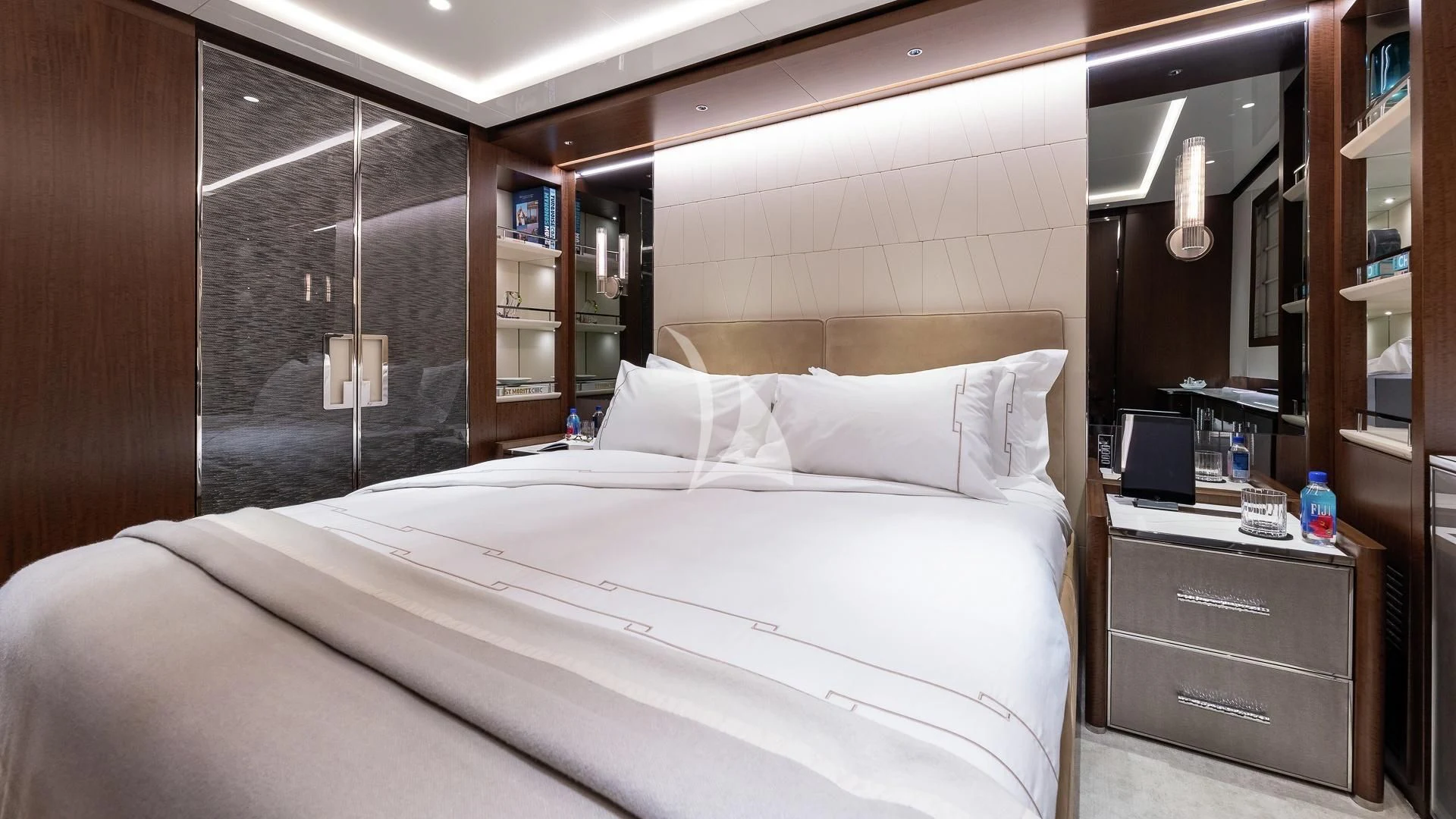 a bed with white sheets aboard ENTERPRISE Yacht for Charter
