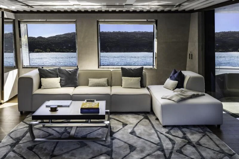 a living room with a large window aboard ENTERPRISE Yacht for Charter
