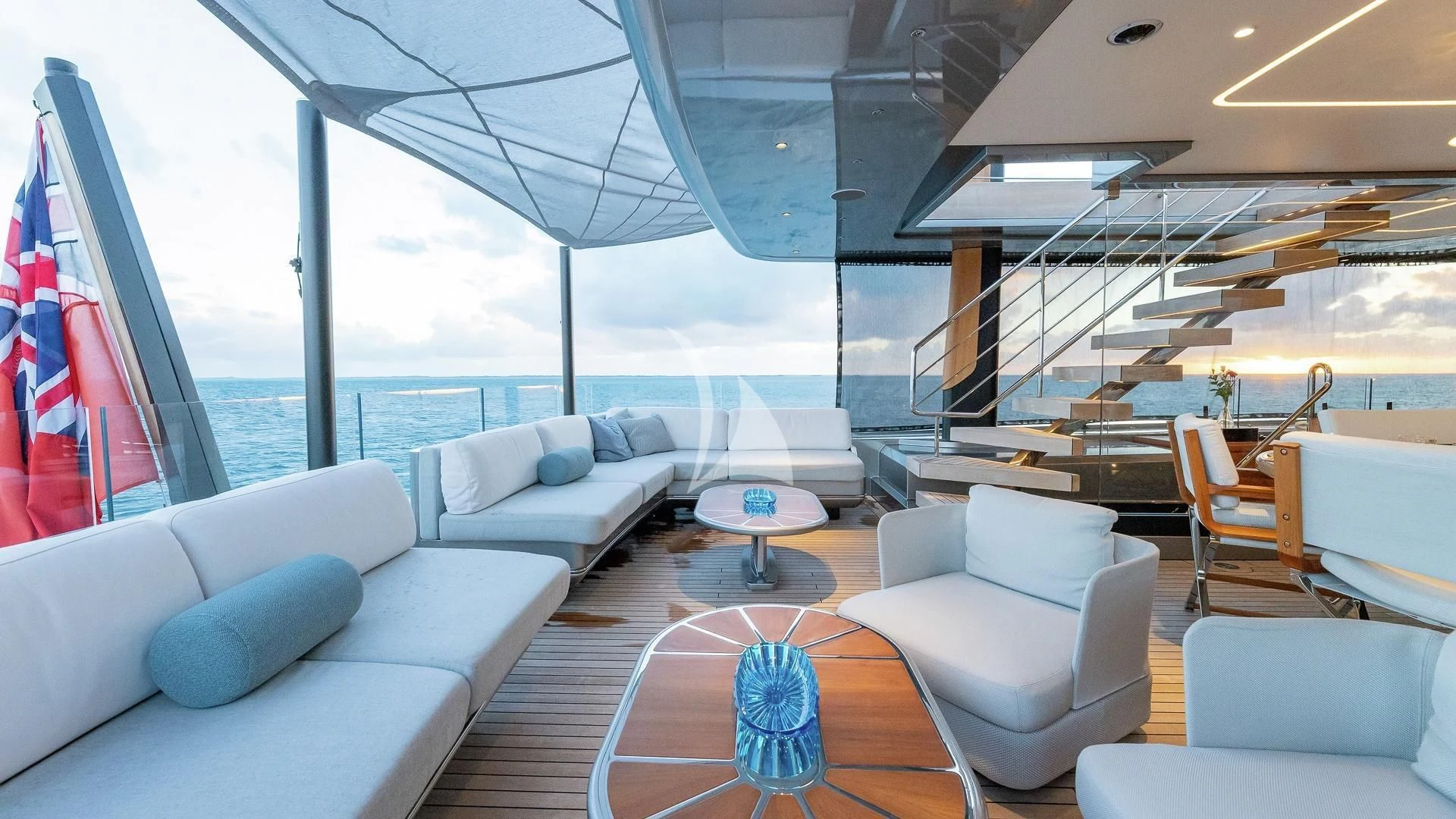 a large living room with a large patio and a large window aboard ENTERPRISE Yacht for Charter