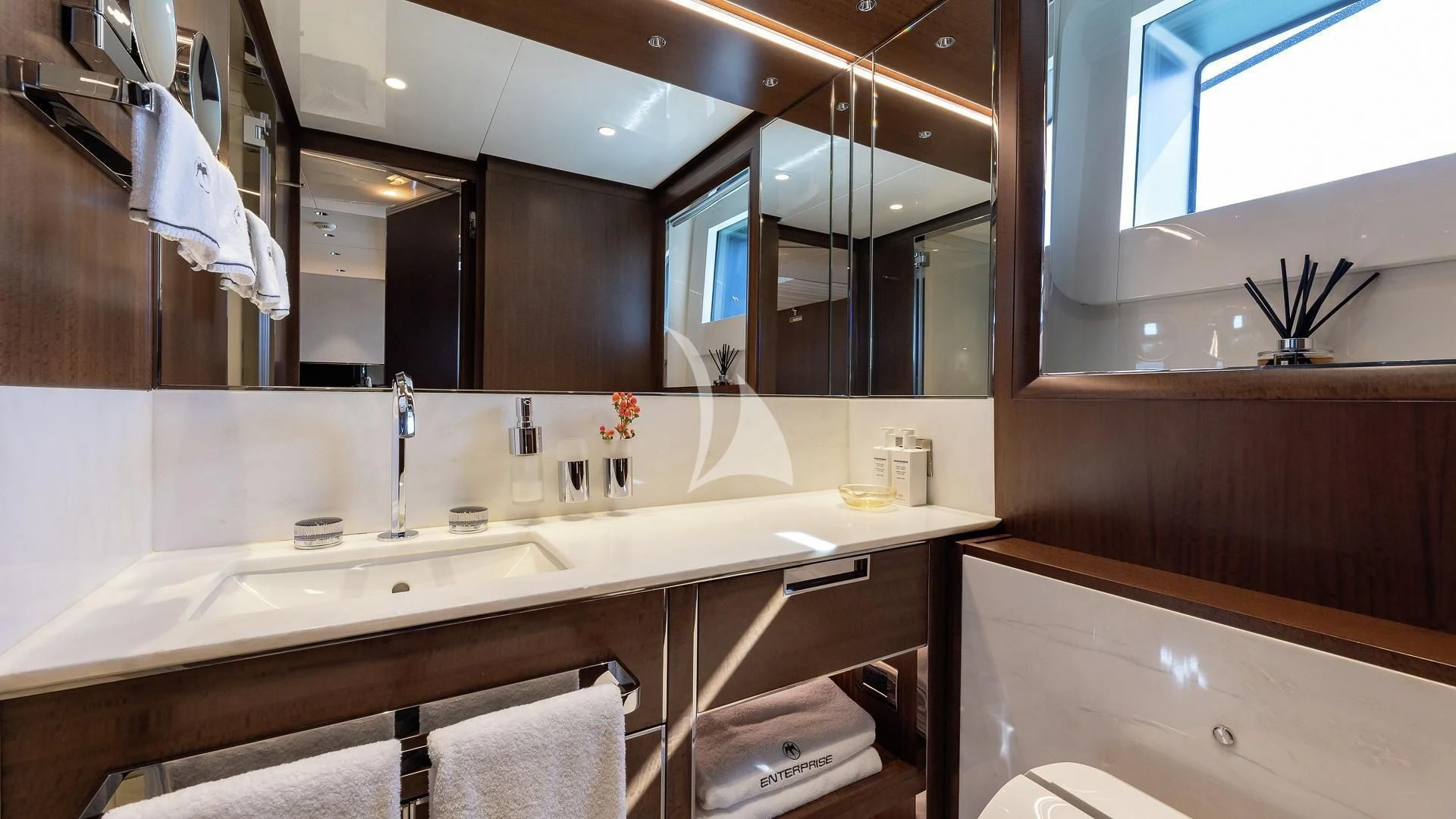 a bathroom with a large mirror aboard ENTERPRISE Yacht for Charter