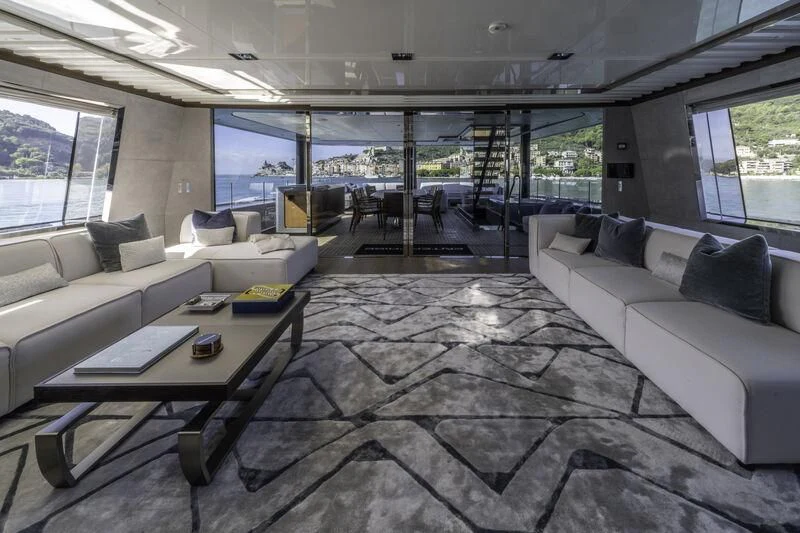 a room with a couch and a table aboard ENTERPRISE Yacht for Charter
