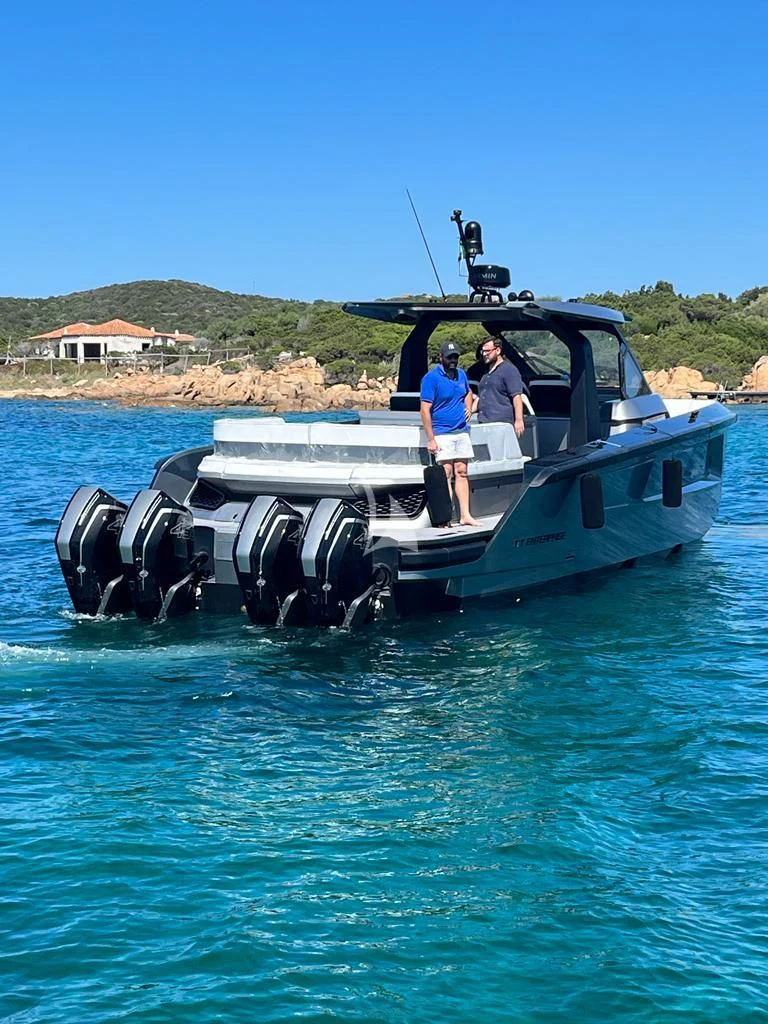 a couple of men in a boat aboard ENTERPRISE Yacht for Charter