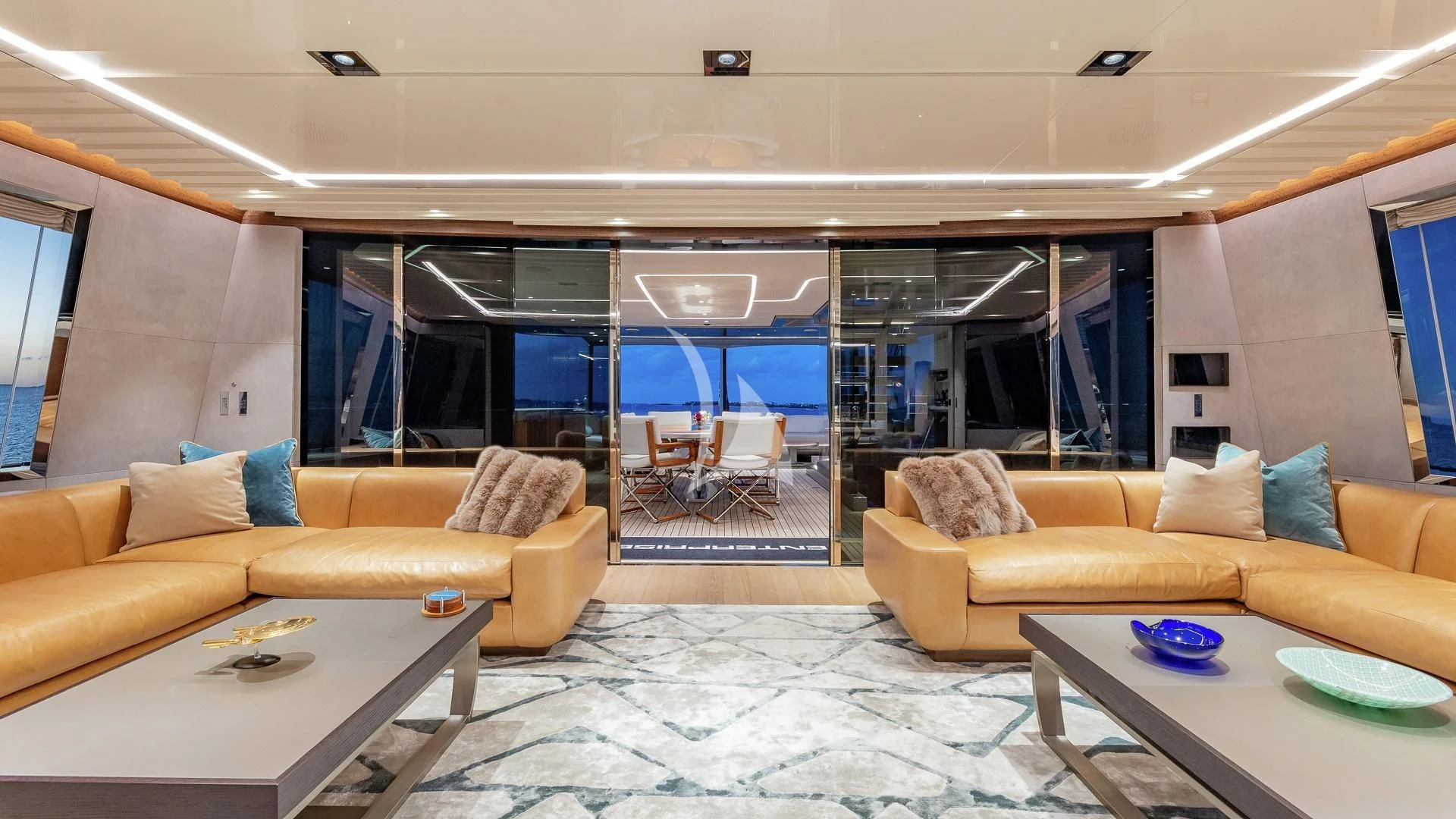 a living room with a large glass window aboard ENTERPRISE Yacht for Charter