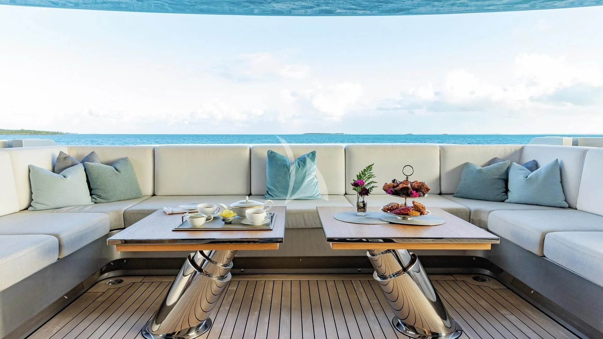 a living room with a couch and a table aboard ENTERPRISE Yacht for Charter
