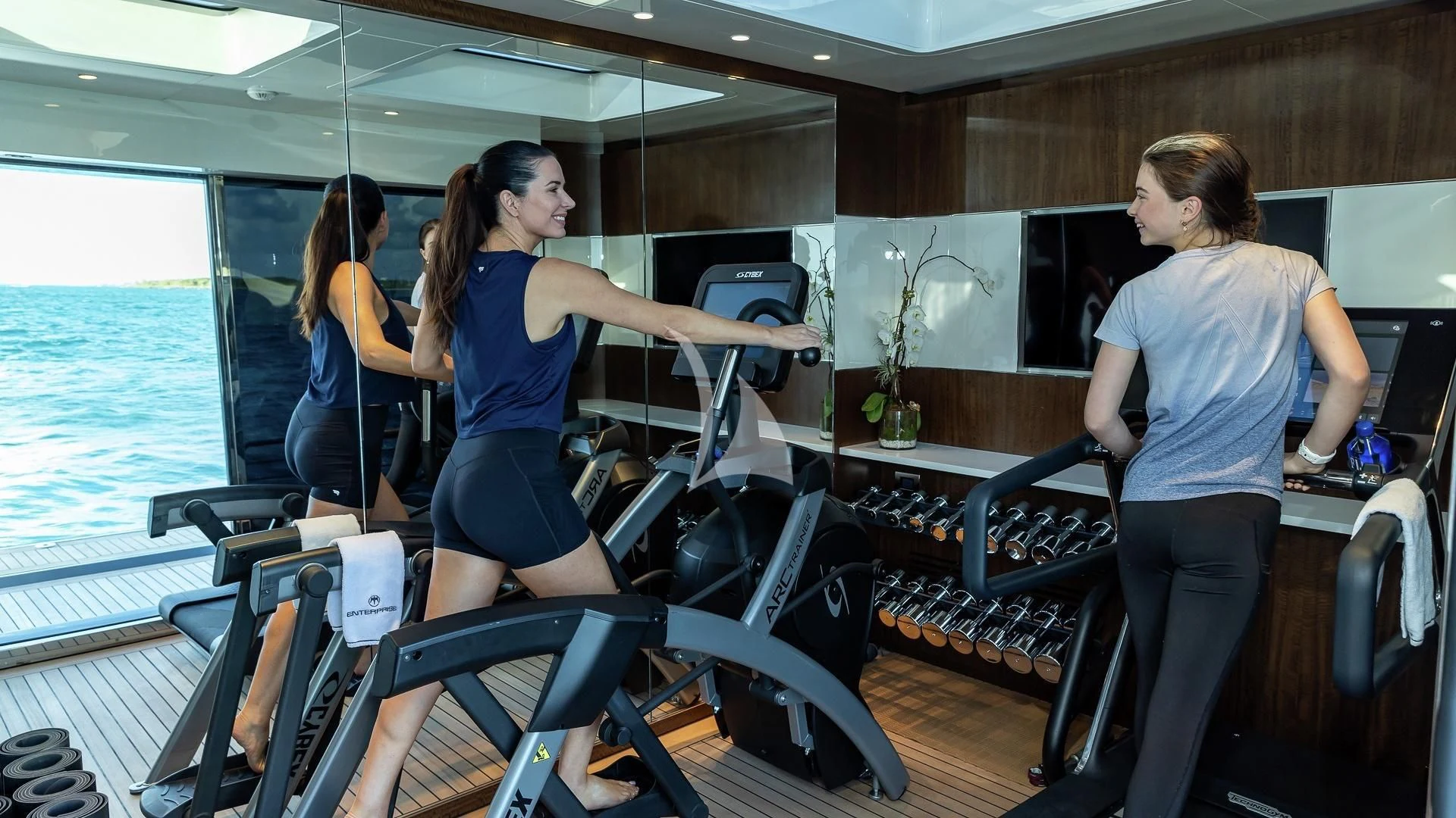 a group of people working out on a boat aboard ENTERPRISE Yacht for Charter