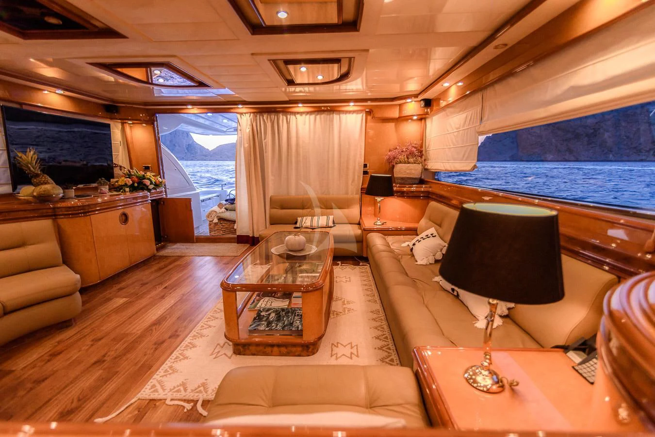 a living room with a large window aboard NEPHENTA PRIMERO Yacht for Sale