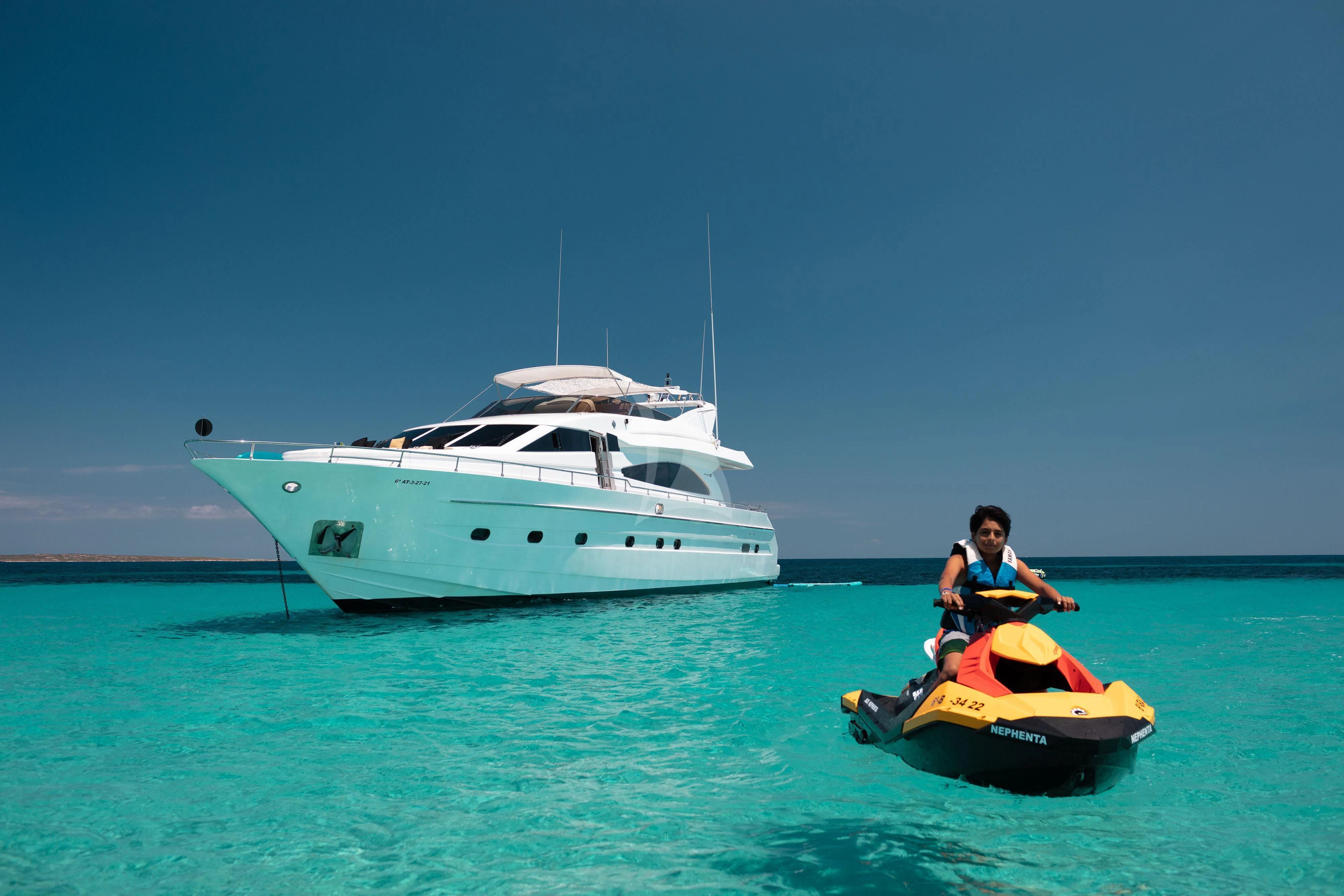 a boy and a girl on a boat in the water aboard NEPHENTA PRIMERO Yacht for Sale