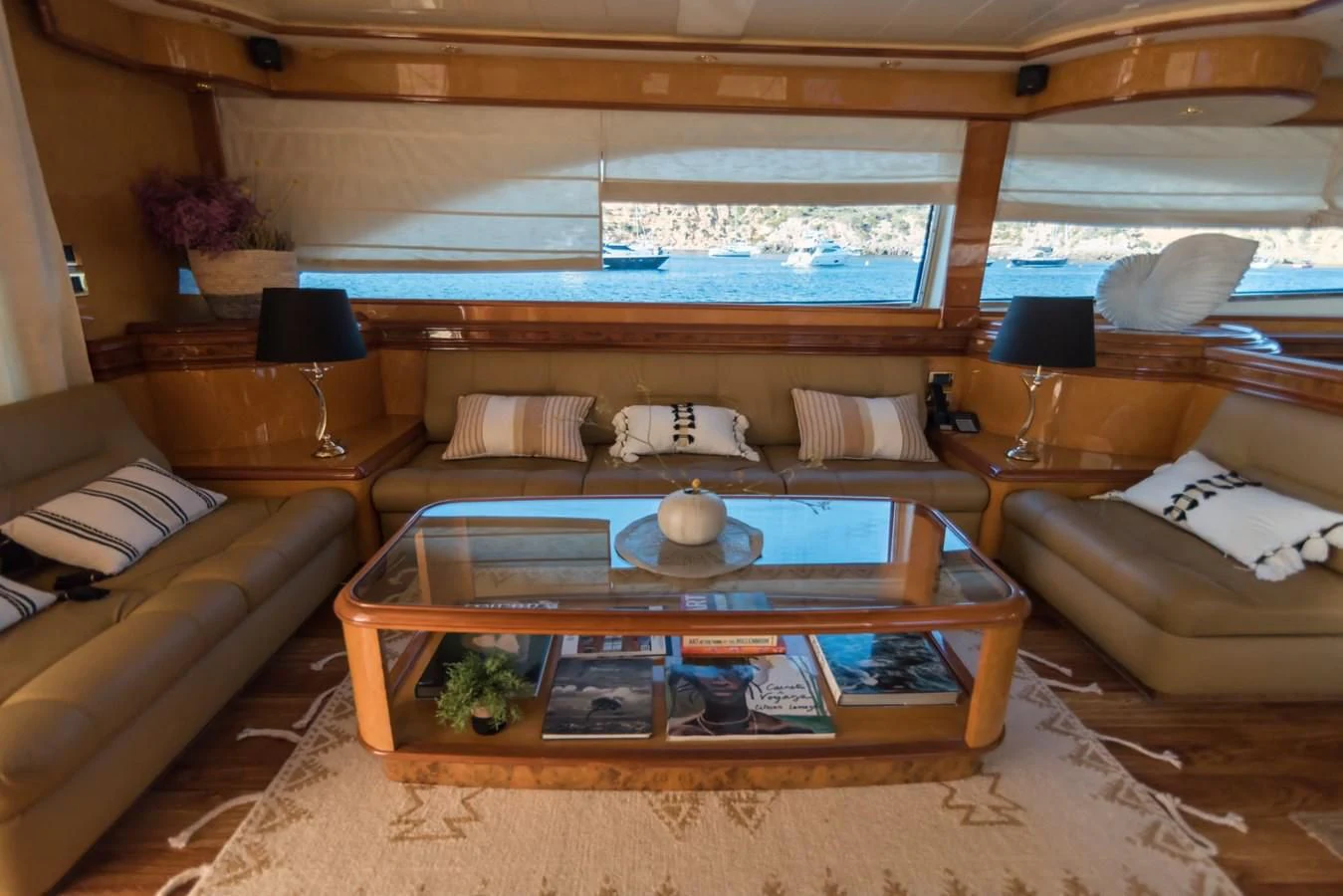 a living room with a large window aboard NEPHENTA PRIMERO Yacht for Sale