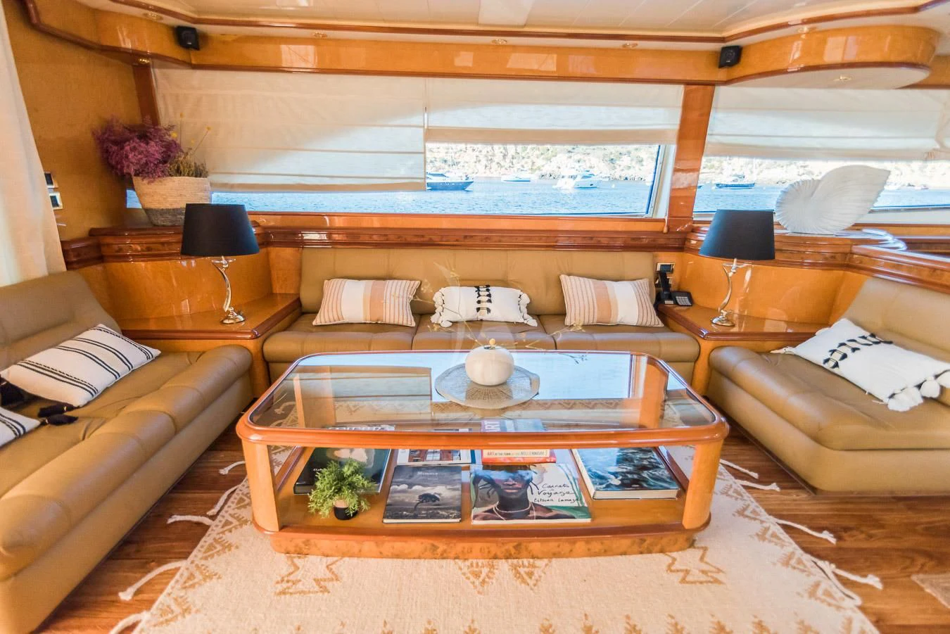a living room with a large window aboard NEPHENTA PRIMERO Yacht for Sale