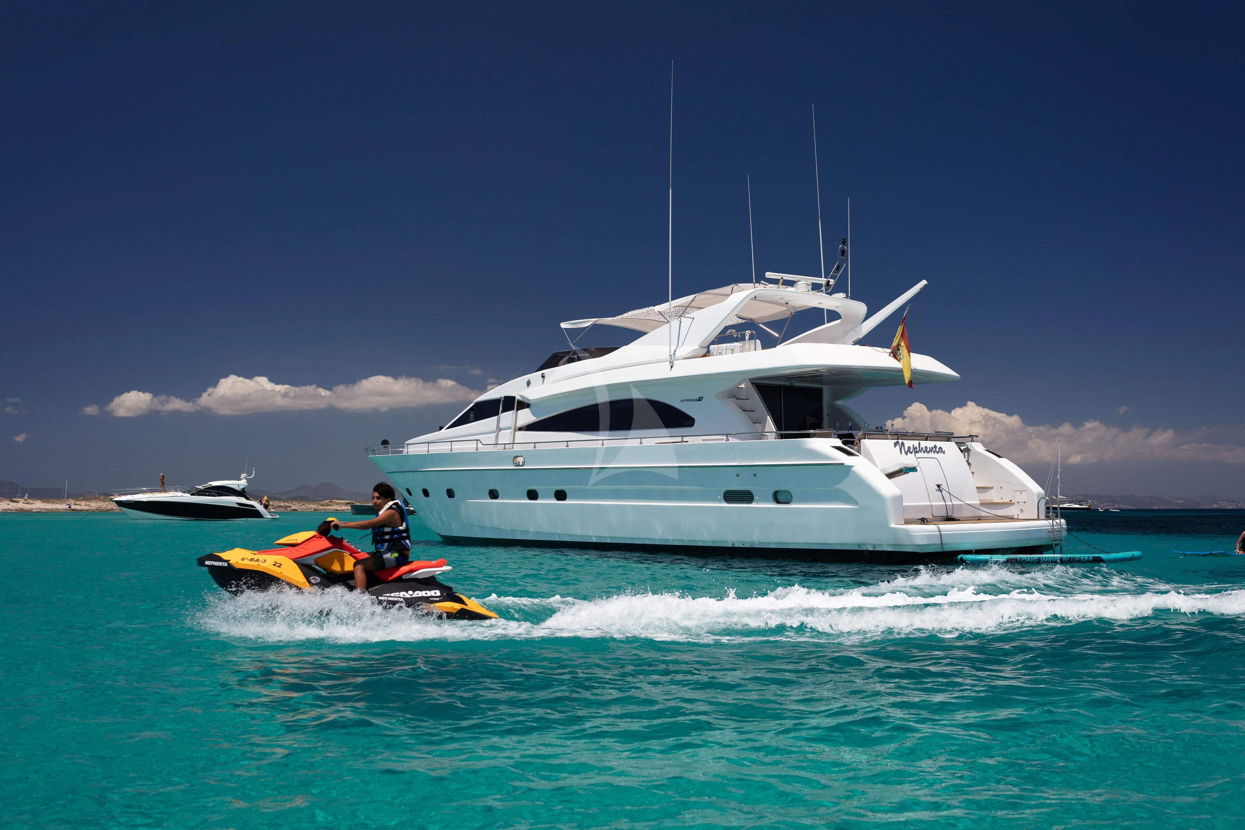 a boat in the water with a person in a kayak aboard NEPHENTA PRIMERO Yacht for Sale