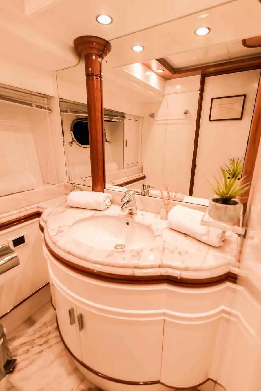 a bathroom with a large mirror aboard NEPHENTA PRIMERO Yacht for Sale