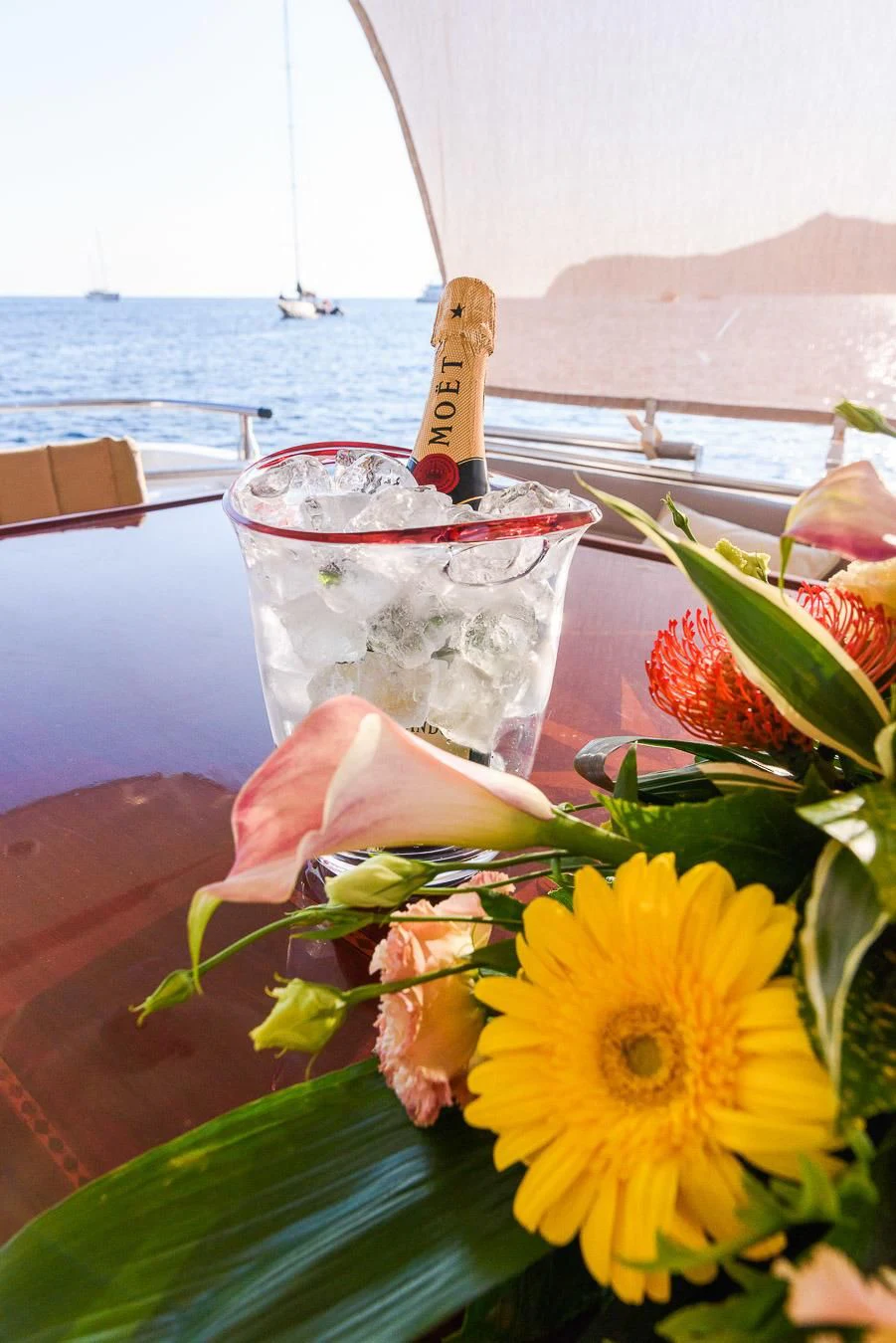 a glass of water with a flower in it aboard NEPHENTA PRIMERO Yacht for Sale