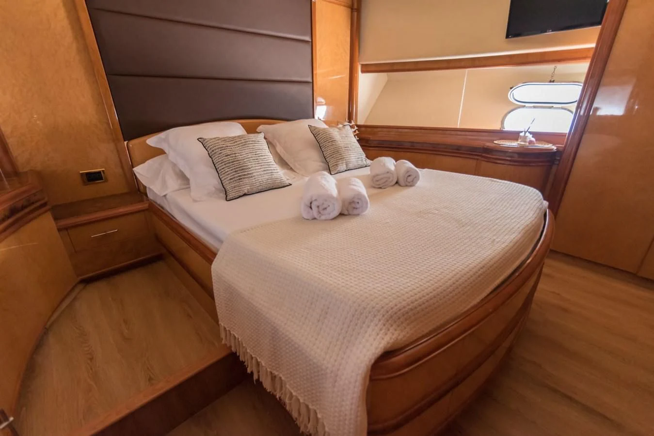 a bed with a white comforter aboard NEPHENTA PRIMERO Yacht for Sale