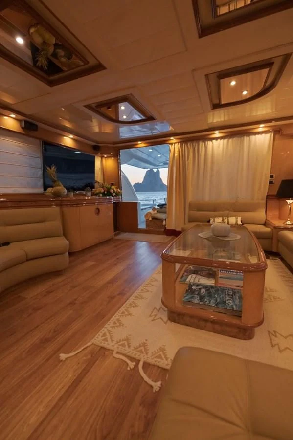 a living room with a large window aboard NEPHENTA PRIMERO Yacht for Sale