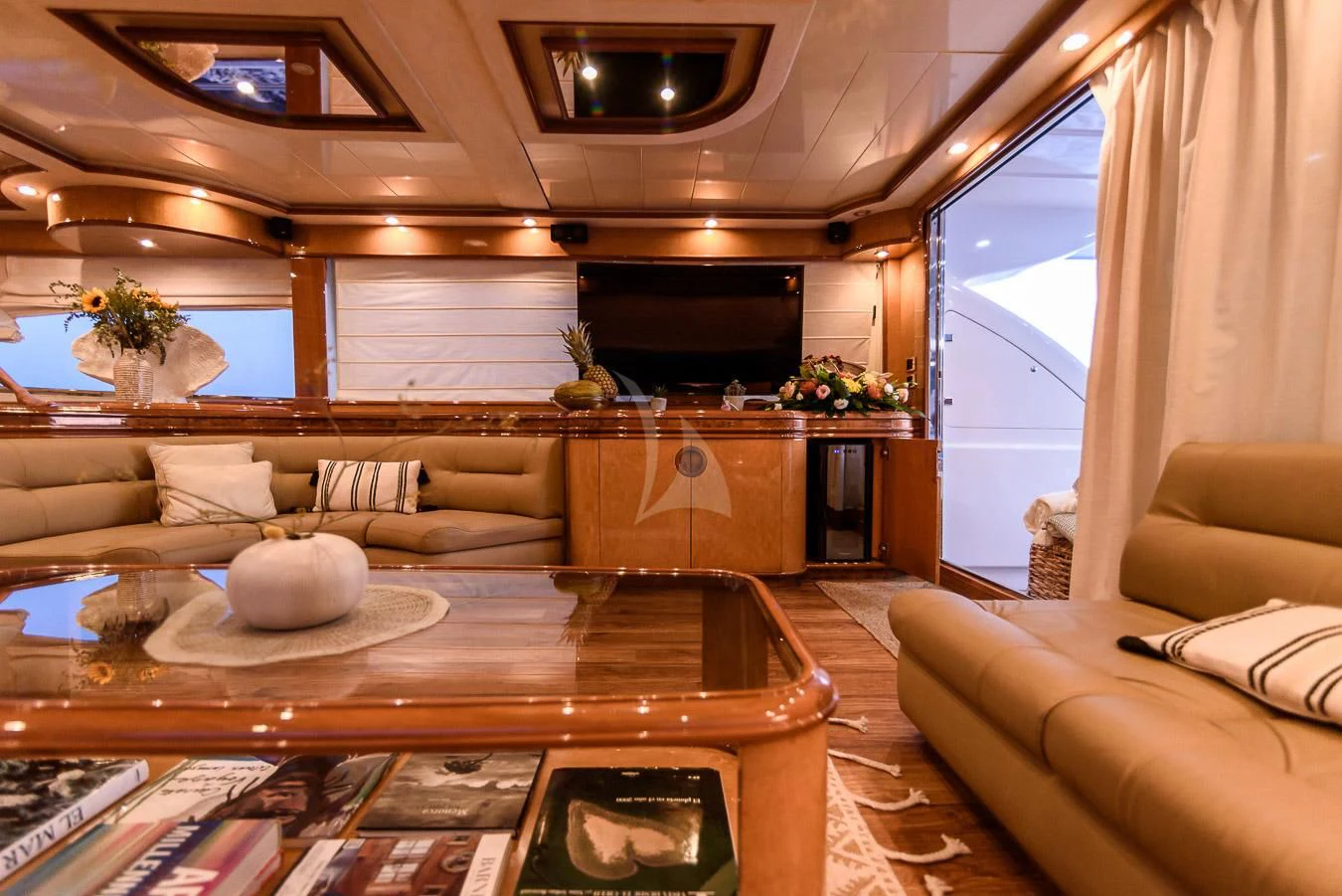 a living room with a large window aboard NEPHENTA PRIMERO Yacht for Sale