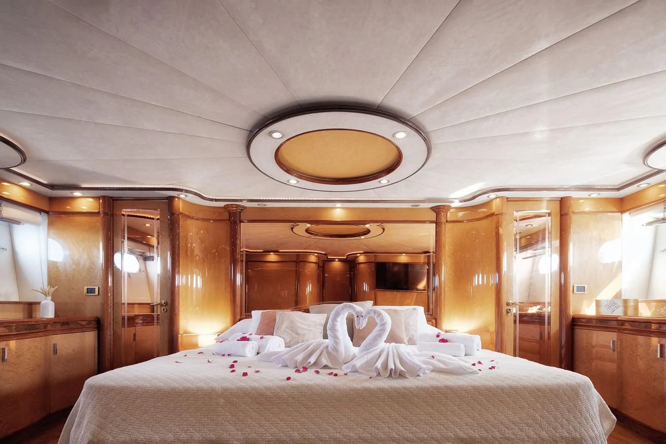 a bed with white sheets aboard NEPHENTA PRIMERO Yacht for Sale