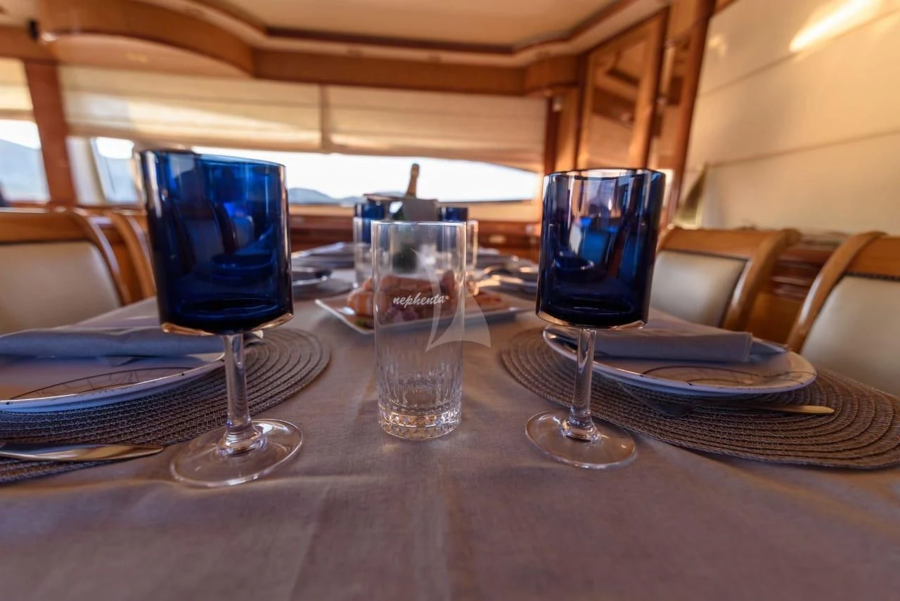 a group of wine glasses on a table aboard NEPHENTA PRIMERO Yacht for Sale