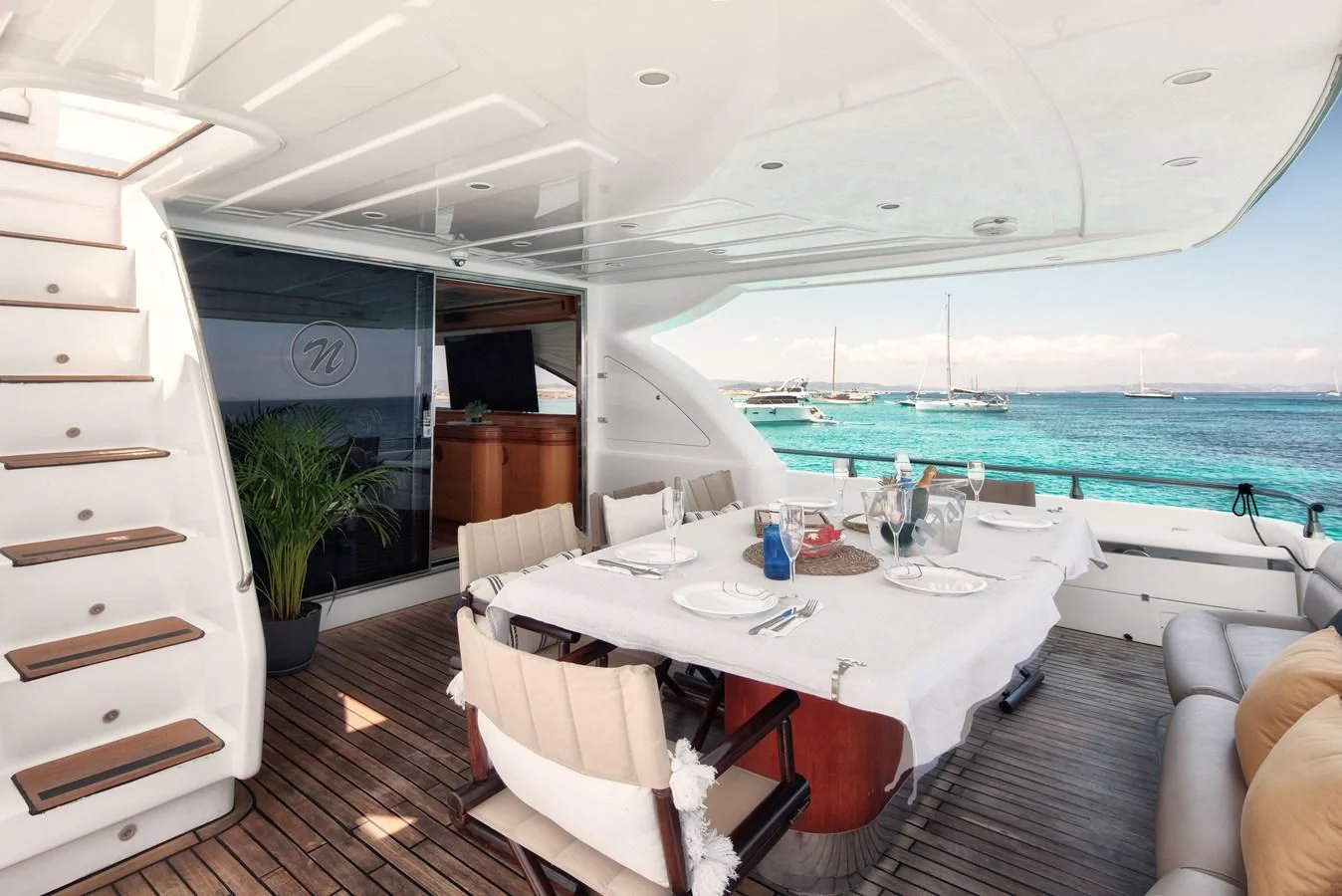 a room with a table and chairs aboard NEPHENTA PRIMERO Yacht for Sale