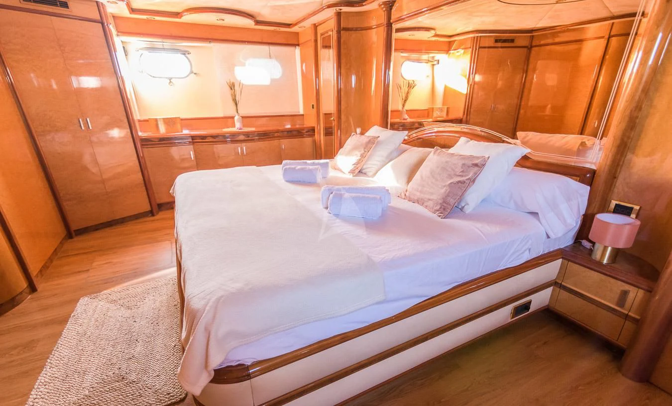 a bed in a room aboard NEPHENTA PRIMERO Yacht for Sale