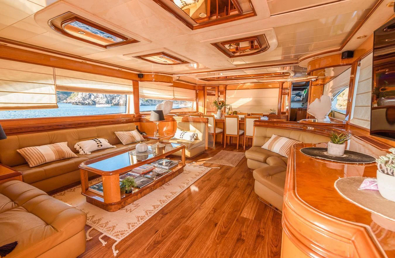 a living room with a large window aboard NEPHENTA PRIMERO Yacht for Sale