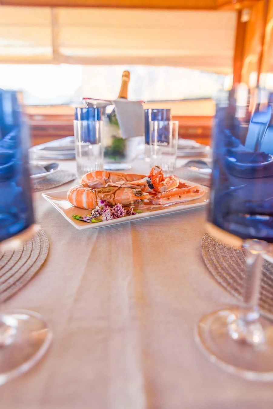 a plate of food on a table aboard NEPHENTA PRIMERO Yacht for Sale