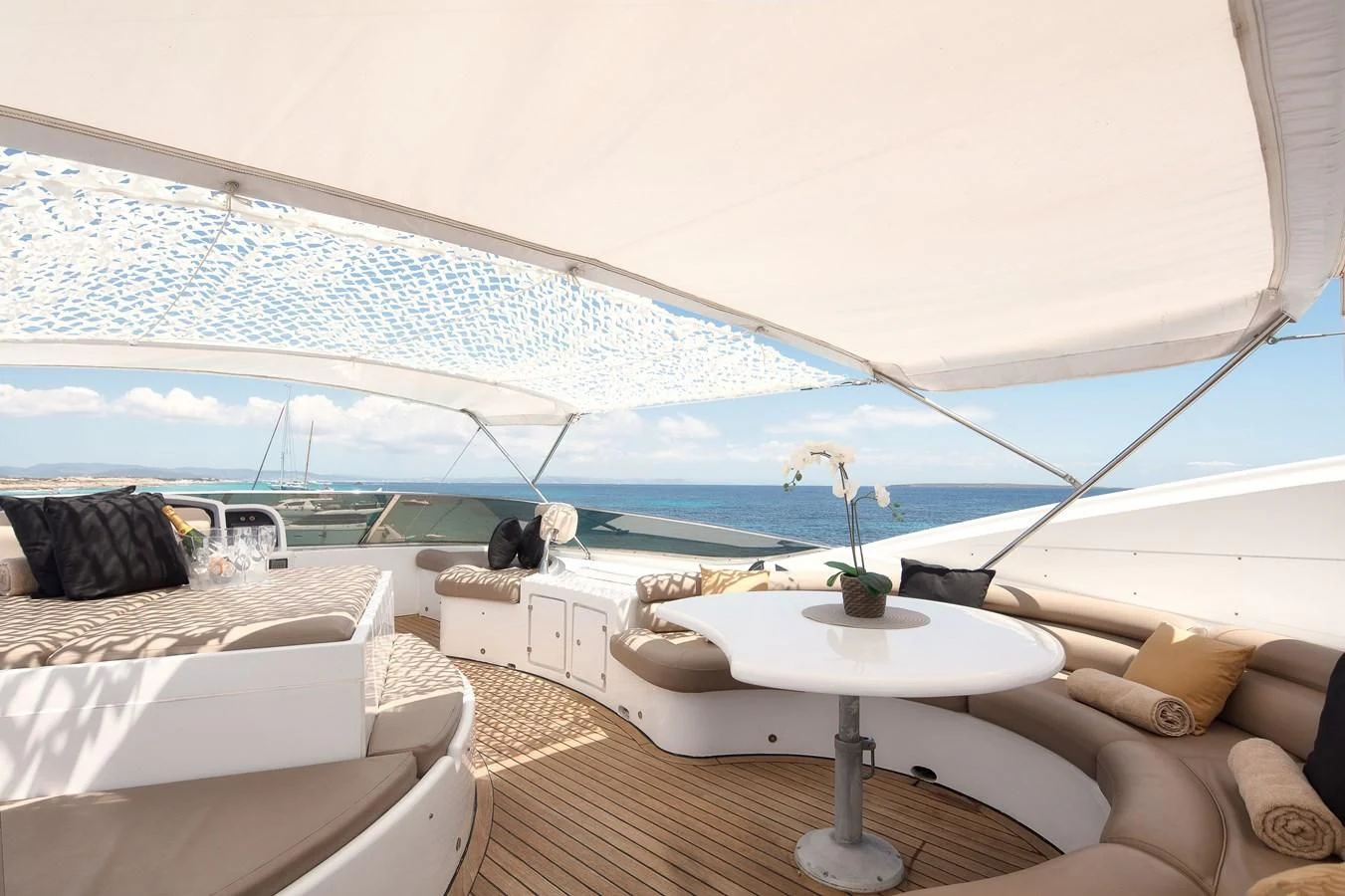 a room with a table and chairs aboard NEPHENTA PRIMERO Yacht for Sale