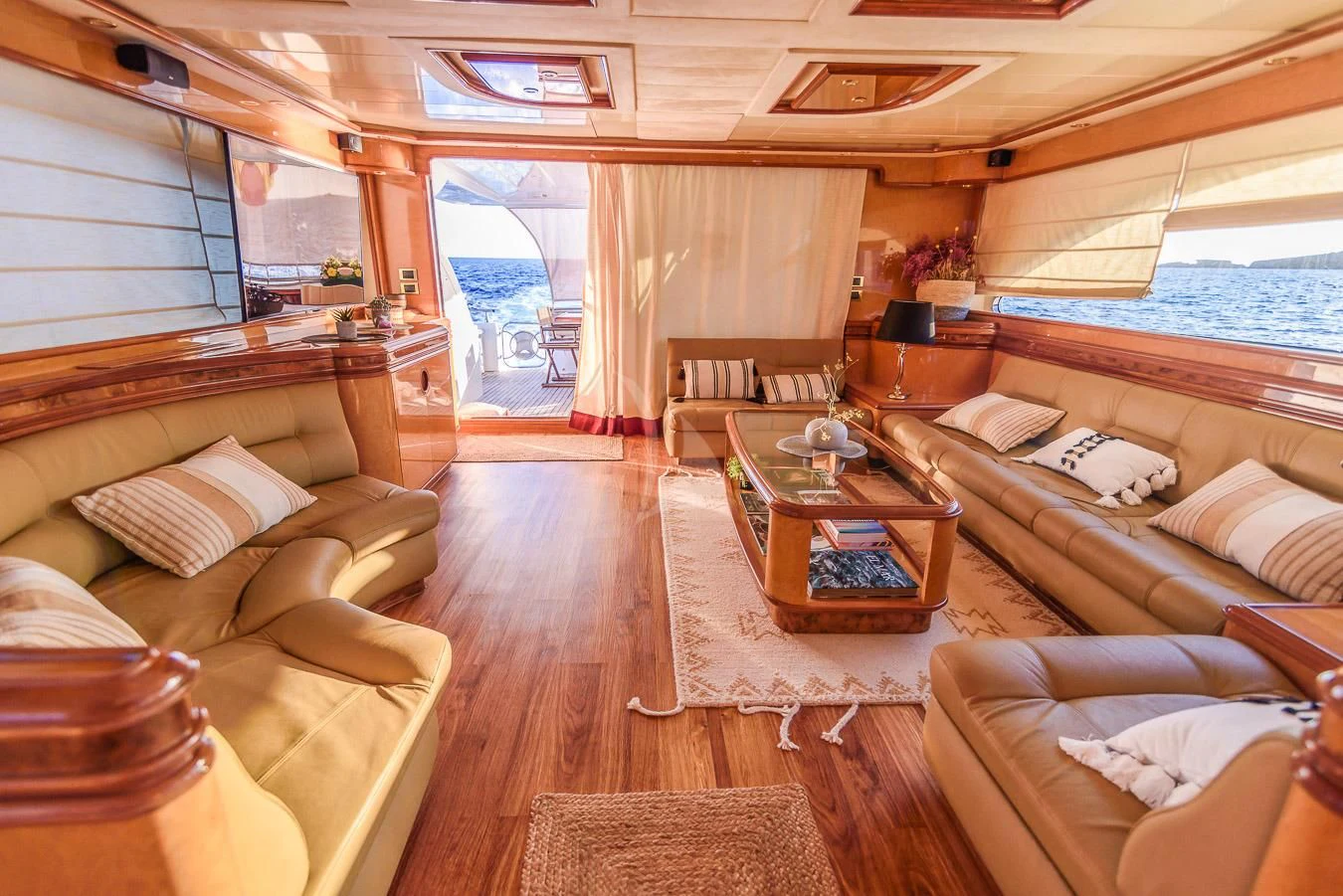 a room with a couch and a table aboard NEPHENTA PRIMERO Yacht for Sale