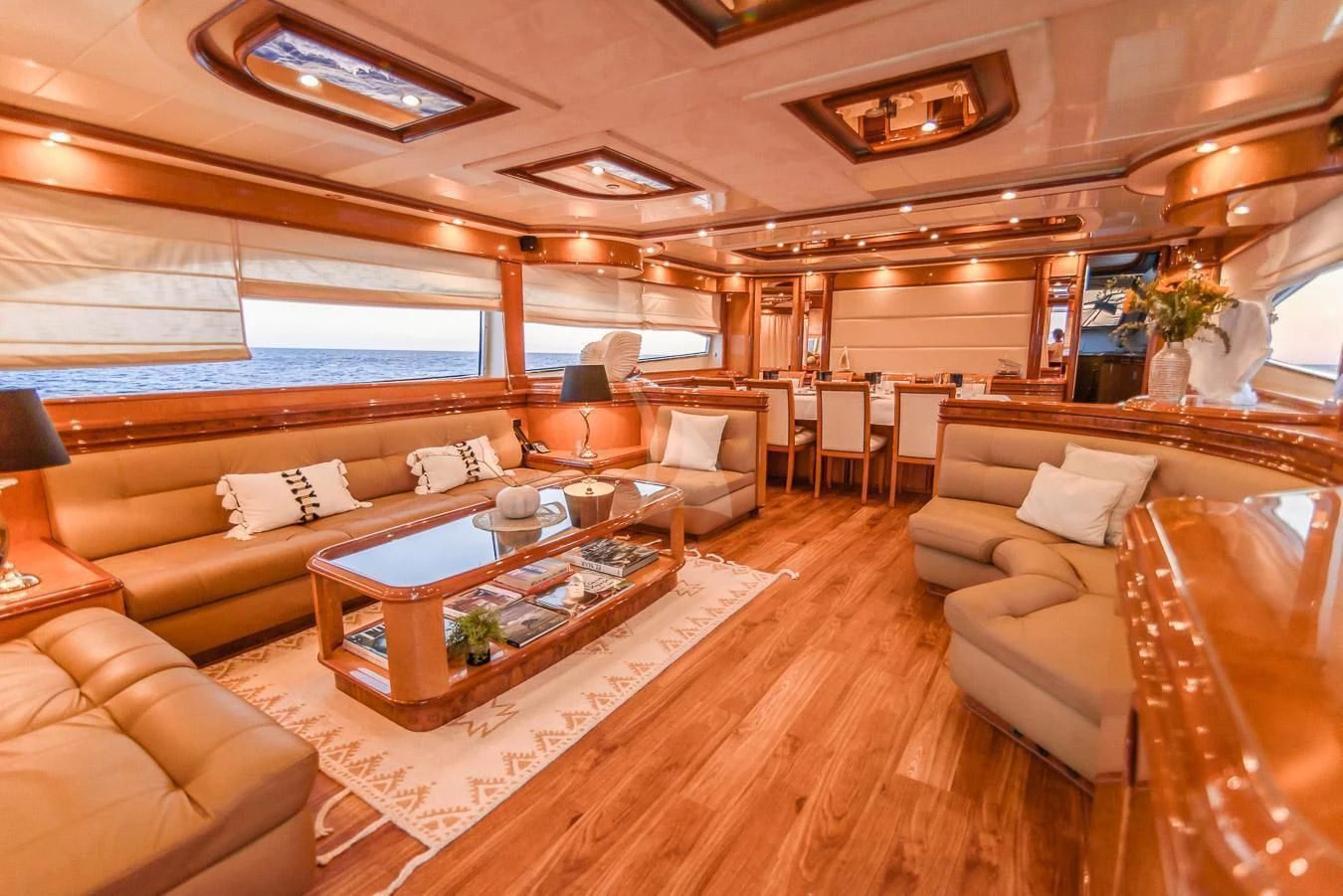 a living room with a large window aboard NEPHENTA PRIMERO Yacht for Sale