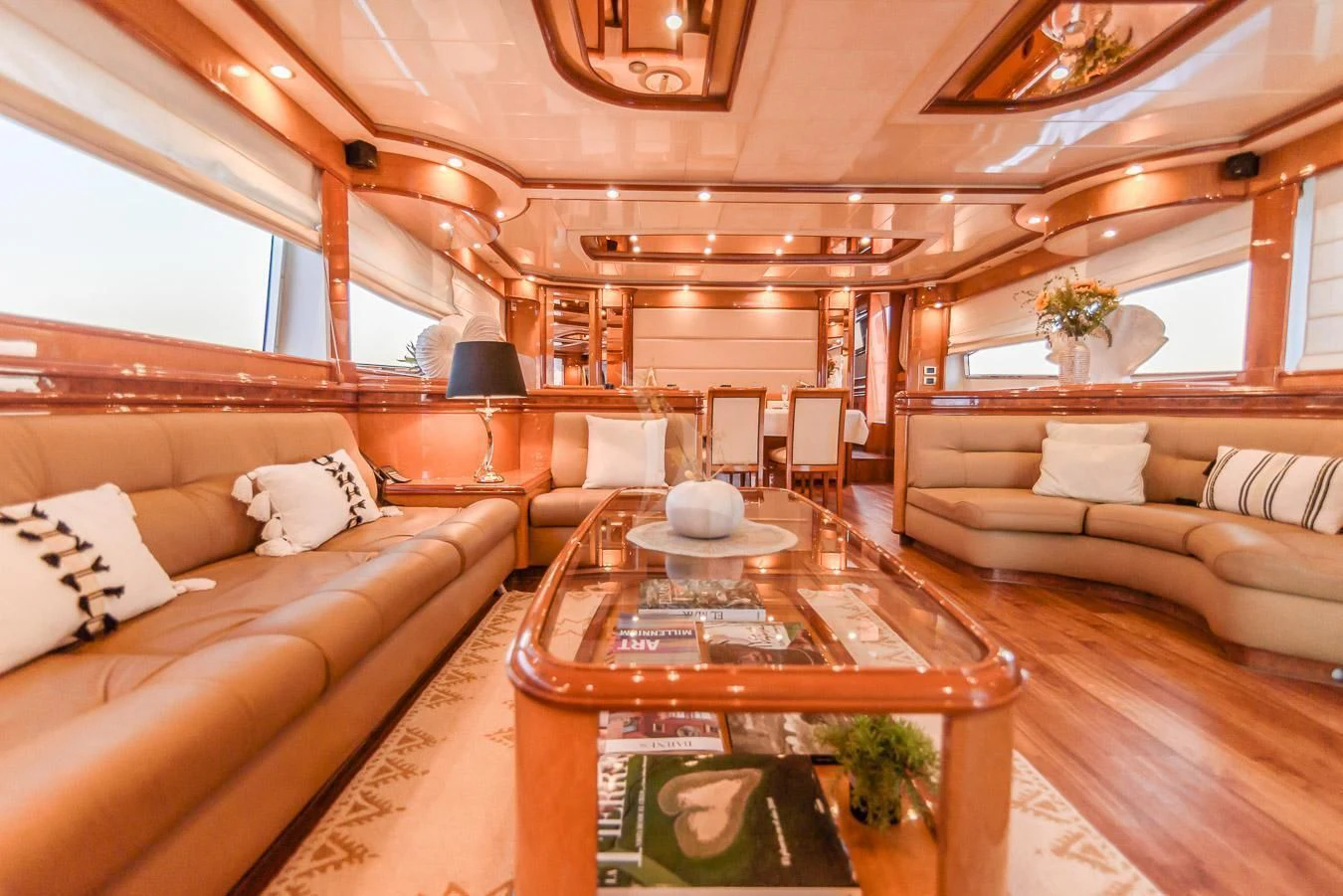 a living room with a large window aboard NEPHENTA PRIMERO Yacht for Sale