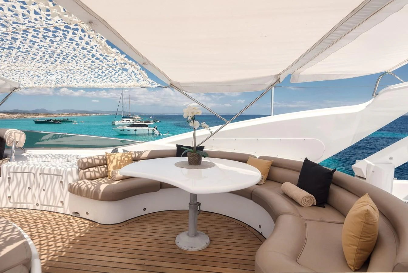 a lounge chair on a deck overlooking a body of water aboard NEPHENTA PRIMERO Yacht for Sale