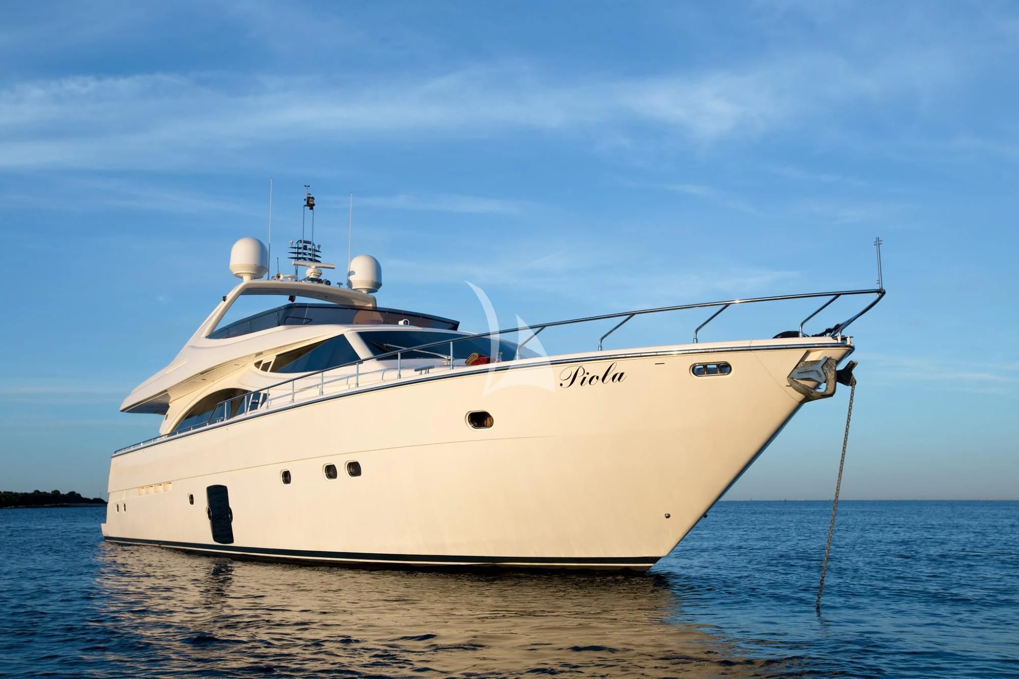 a white boat on the water aboard PIOLA Yacht for Sale